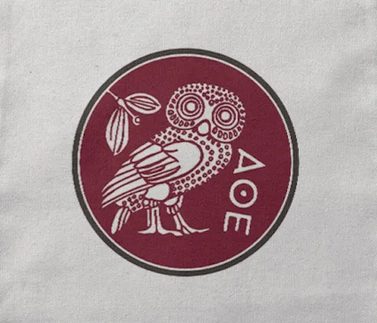 CCA owl emblem in maroon with Greek letters printed on canvas
